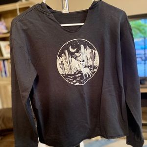 Black crop top hoodie with desert scene